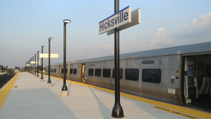Hicksville Train Station platform with Hicksville sign
