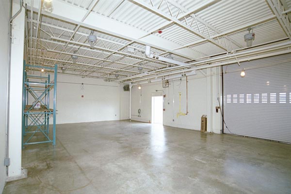 Inside of a white facility with garage
