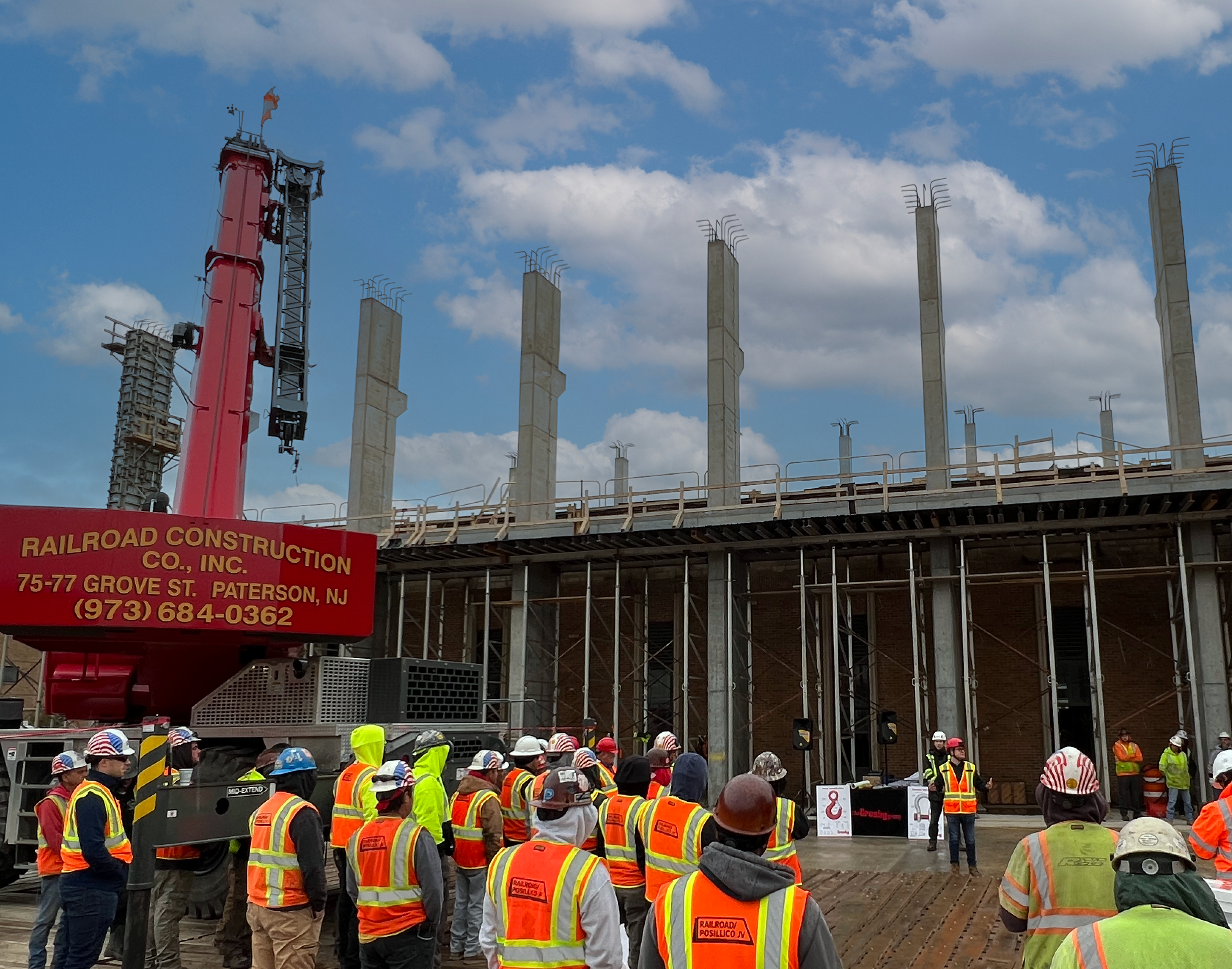 Men standing around doing safety training