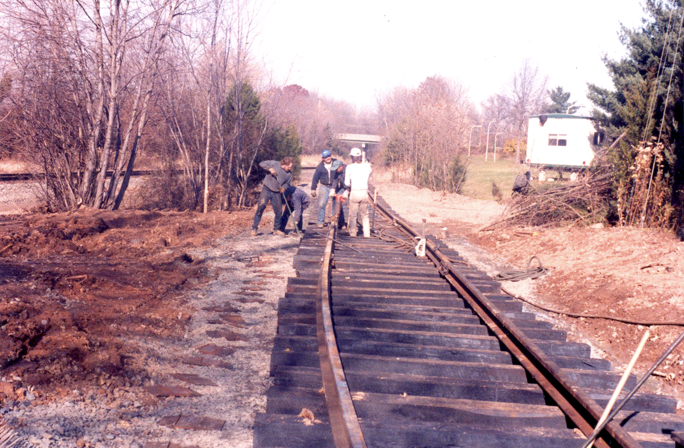 Men by the track at Fort Dix
