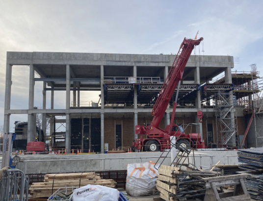 building reconstruction with red crane