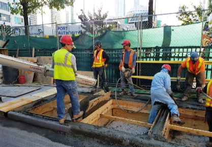 Picture of men working on a flood mitigation