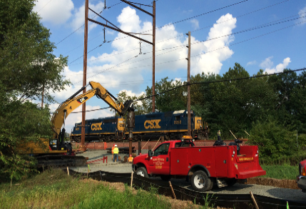 Picture of red truck with crane behind